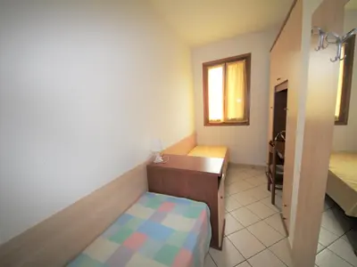 Letto o letti in una camera di Family stay in Rosolina Mare near sea