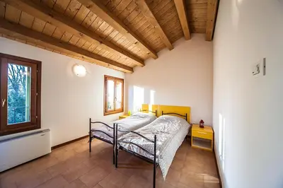 Letto o letti in una camera di Rifugio Natura Delta Po Rosolina