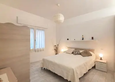 Letto o letti in una camera di Villa Nadia - Carraro Immobiliare - Family Apartments