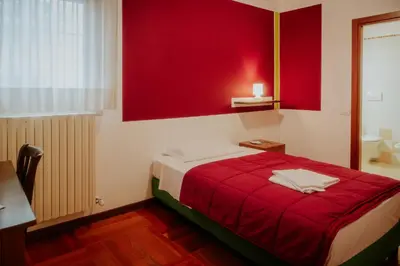 Letto o letti in una camera di Casa Accademia