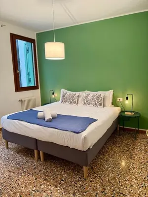 Letto o letti in una camera di Wake up next to Vicenza's Most Beautiful Square!