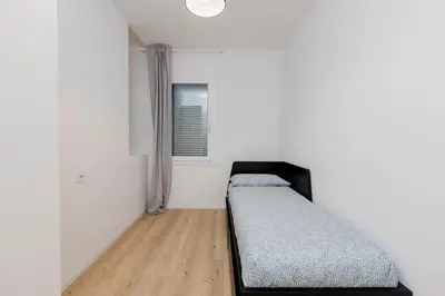 Letto o letti in una camera di Appartamento con 2 Camere vicino a Centro e Stazione, Bassano del Grappa