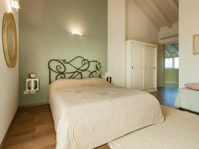 Letto o letti in una camera di B&B Cà Dea Calle