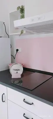 Cucina o angolo cottura di APPARTAMENTO ROSA OVER THE RAINBOW APARTMENTS Lido di Jesolo