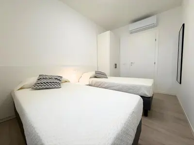Letto o letti in una camera di Permar - Home immobiliare
