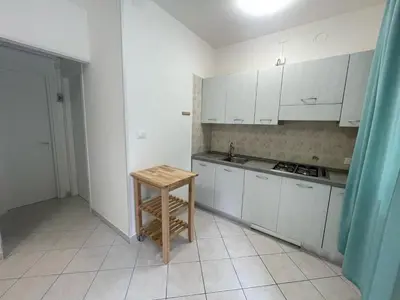 Cucina o angolo cottura di Comfortable flat with private garden in Rosolina