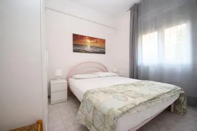 Letto o letti in una camera di Rosolina Mare flat near beach
