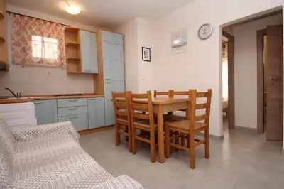 Cucina o angolo cottura di Welcoming apartment for families in Rosolina Mare