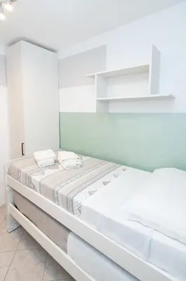 Letto o letti in una camera di Casa Miki