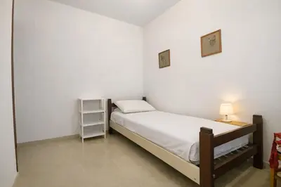 Letto o letti in una camera di Vespucci House Appartamento vicino alla Spiaggia con Aria Condizionata e Parcheggio Gratuito