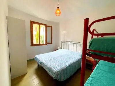 Letto o letti in una camera di Holiday Getaway for 5 near the Beach