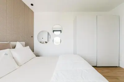Letto o letti in una camera di Jesolo Altamarea The Level Suite