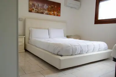 Letto o letti in una camera di Welc-ōM Monte della Madonna Padova