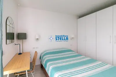 Letto o letti in una camera di Baia Blu - Lido di Jesolo
