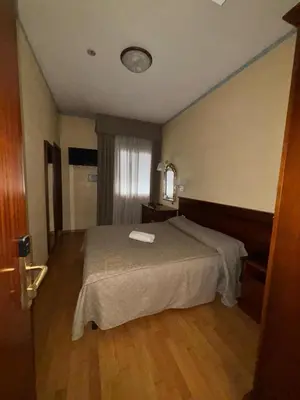 Letto o letti in una camera di Affitta Camere Padova