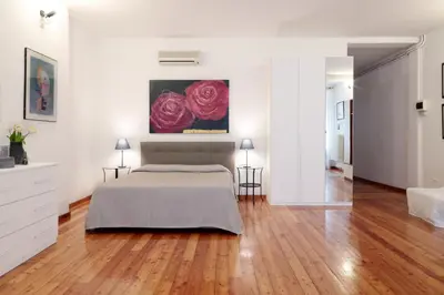Letto o letti in una camera di PadovaResidence Apartments - tra Piazza delle Erbe e il Duomo