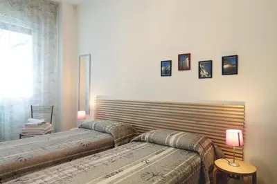 Letto o letti in una camera di PadovaResidence Apartments - vicino Cappella degli Scrovegni e Ospedale