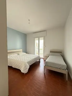 Letto o letti in una camera di RESIDENCE FARO - WALTERIGATO Apartments SOLO PER FAMIGLIE