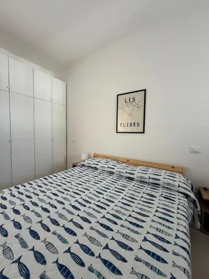 Letto o letti in una camera di RESIDENCE GARDEN -WALTERIGATO Apartments SOLO PER FAMIGLIE