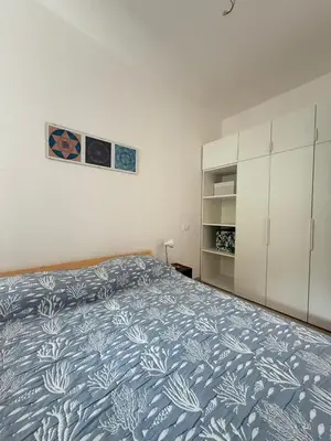 Letto o letti in una camera di RESIDENCE GARDEN -WALTERIGATO Apartments SOLO PER FAMIGLIE
