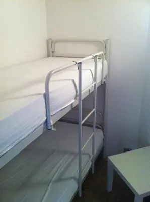 Letto o letti in una camera di RESIDENCE APOLLO - WALTERIGATO Apartments SOLO PER FAMIGLIE
