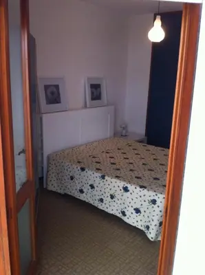 Letto o letti in una camera di RESIDENCE APOLLO - WALTERIGATO Apartments SOLO PER FAMIGLIE