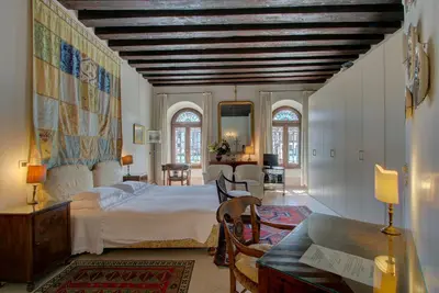 Letto o letti in una camera di TRIBUNO Grand Canal