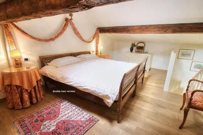 Letto o letti in una camera di MOCENIGO~CanalGrande aperitif