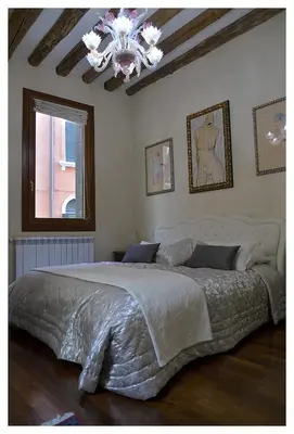 Letto o letti in una camera di Domus Dea