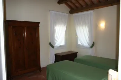 Letto o letti in una camera di Villa Ghislanzoni
