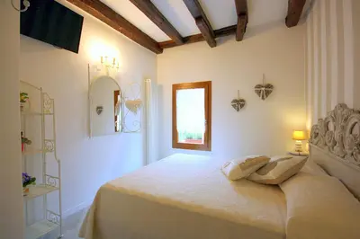 Letto o letti in una camera di Terrazza Biennale