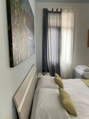 Letto o letti in una camera di Ca' Garibaldi Rooms