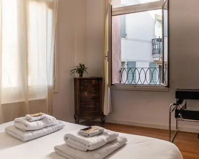 Letto o letti in una camera di Ca' Garibaldi Rooms