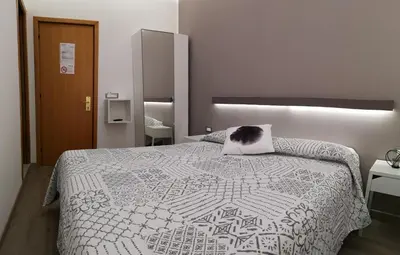 Letto o letti in una camera di Albergo Felice