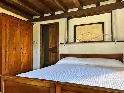 Letto o letti in una camera di Foresteria Di Villa Tiepolo Passi