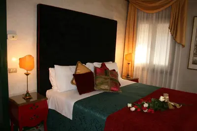 Letto o letti in una camera di Palazzo del Giglio