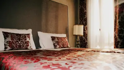 Letto o letti in una camera di Palazzo del Giglio