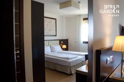 Letto o letti in una camera di GREEN GARDEN Resort - Smart Hotel