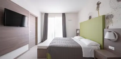 Letto o letti in una camera di Hotel Iris Jesolo