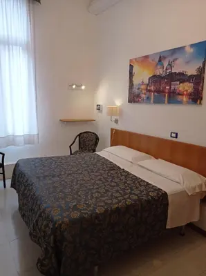 Letto o letti in una camera di Hotel Caneva