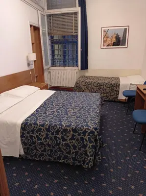 Letto o letti in una camera di Hotel Caneva