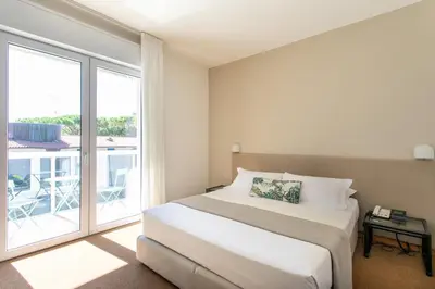 Letto o letti in una camera di Harvey Suites Hotel & Residence