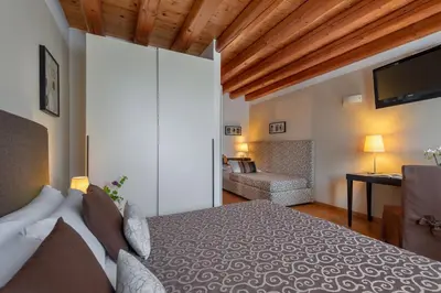 Letto o letti in una camera di Hotel Rovere