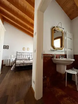 Letto o letti in una camera di Al Piccolo Clarin