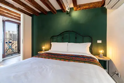 Letto o letti in una camera di Ca' dell'Arciere Apartments