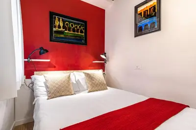 Letto o letti in una camera di Ca' dell'Arciere Apartments