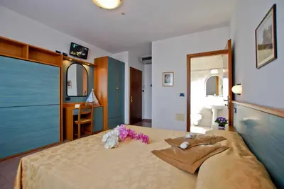 Letto o letti in una camera di Hotel Jonni