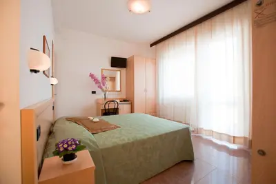 Letto o letti in una camera di Hotel Jonni