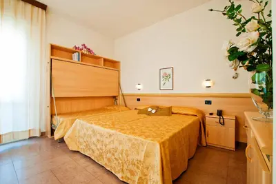 Letto o letti in una camera di Hotel Jonni
