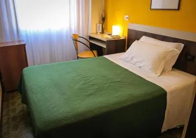 Letto o letti in una camera di Hotel Centrale